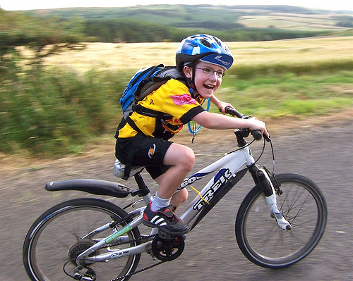 Josh cycling as he smiles (or smiling as he cycles)